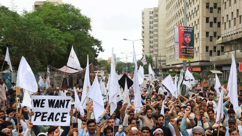 People rally to protest against the militant violence and demanding to restore peace during a protest in Karachi