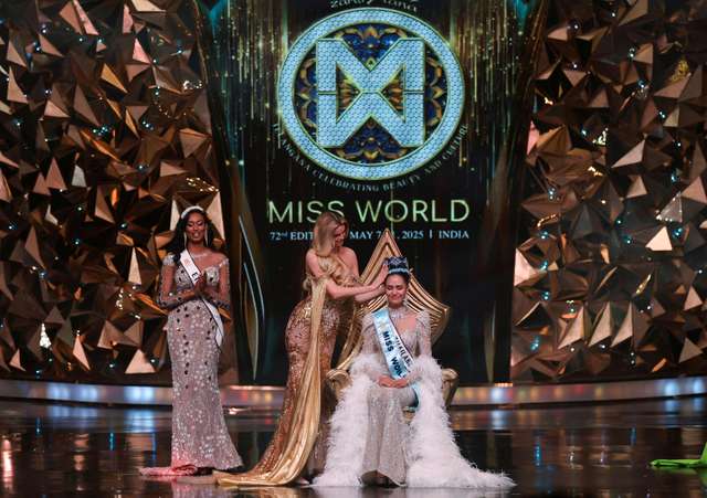Thailand's Opal Suchata Chuangsri reacts after being crowned Miss World by last year's Miss World winner, Czech Republic's Krystyna Pyszkova, at the 72nd Miss World finale in Hyderabad