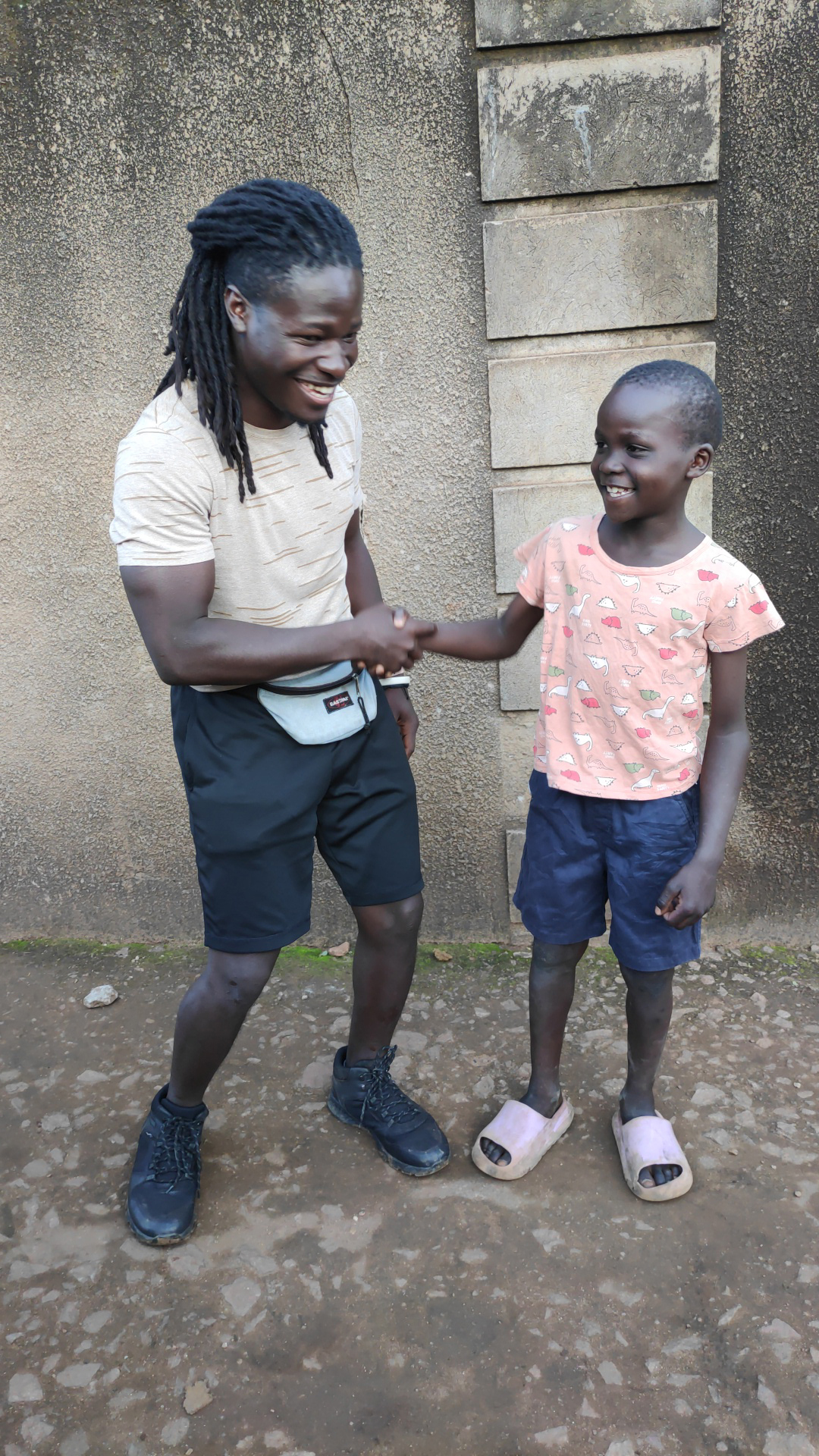 Clinton Kibuuka with one of the kids peformer