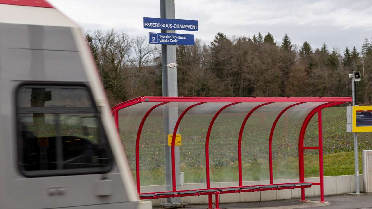 Train passes through the station close to where a man armed held 15 hostages in Essert-sous-Champvent