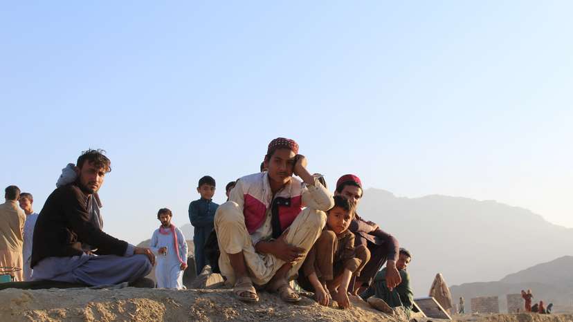 Afghan nationals rest at a camp after returning from Pakistan at Torkham border crossing