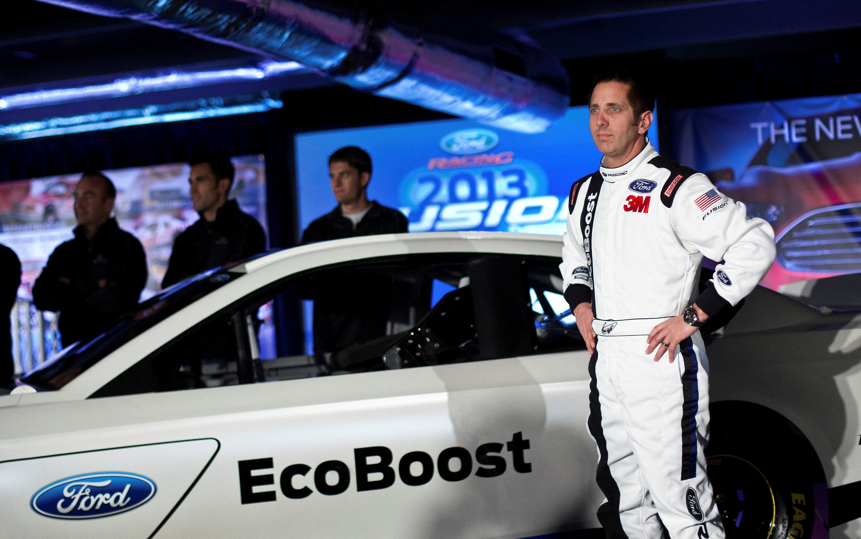FILE PHOTO: Driver Biffle poses for photographs in front of the new 2013 Ford stock car after an announcement during the NASCAR Media Tour in Concord