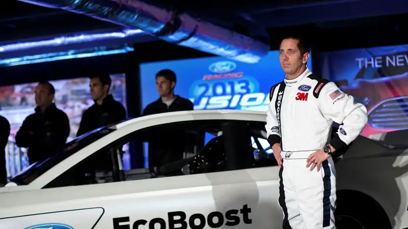 FILE PHOTO: Driver Biffle poses for photographs in front of the new 2013 Ford stock car after an announcement during the NASCAR Media Tour in Concord