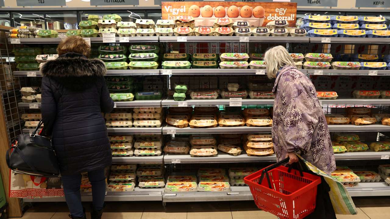 Customers shop at a supermarket in Budapest