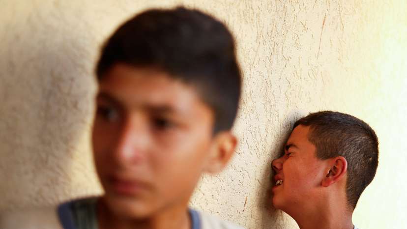 Mourners react next to the bodies of Palestinians killed in Israeli strikes in Khan Younis, in the southern Gaza Strip