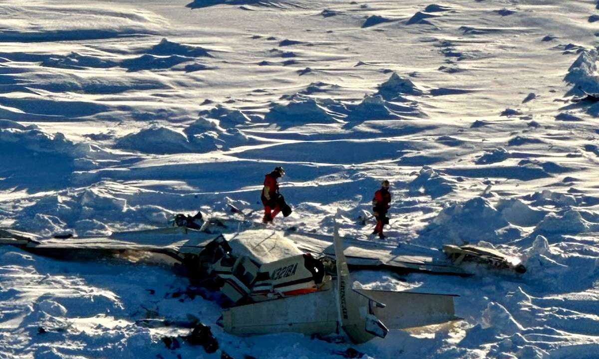 Authorities inspect the wreckage of the Cessna 208B Grand Caravan aircraft operated by Bering Air, near Nome