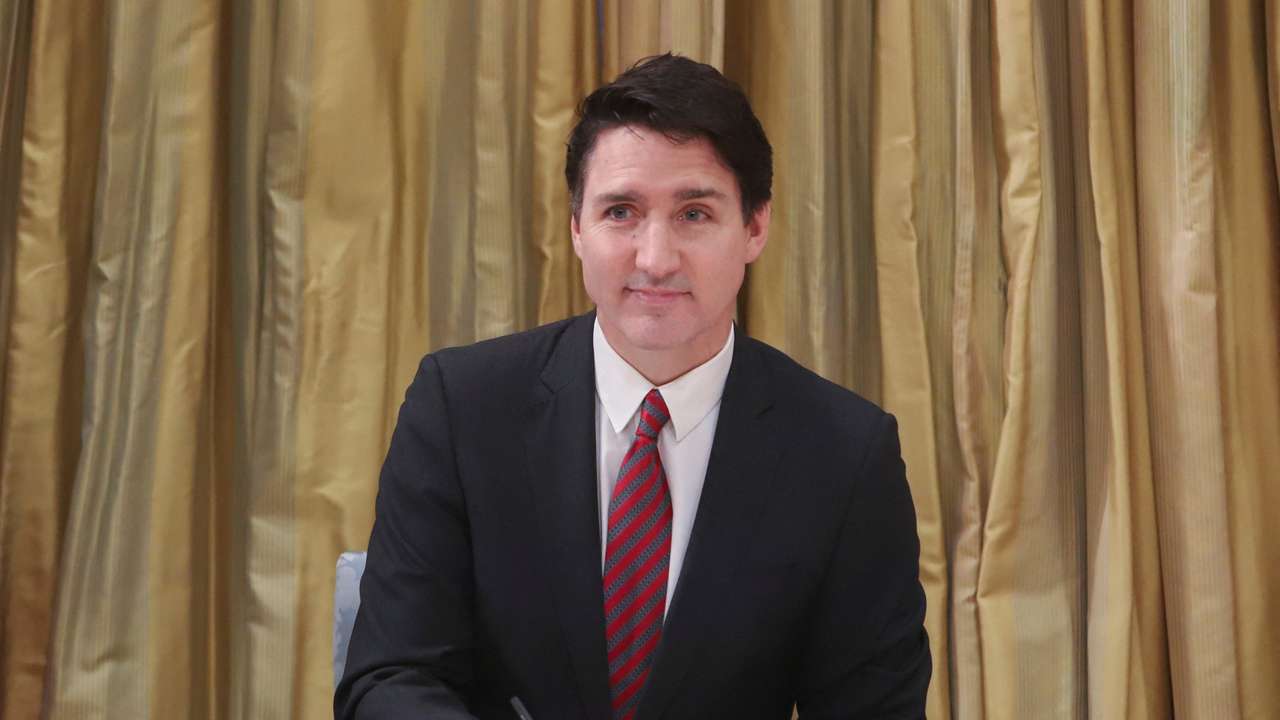 Canada's PM Trudeau signs a register as he takes part in swearing-in ceremony at Rideau Hall in Ottawa