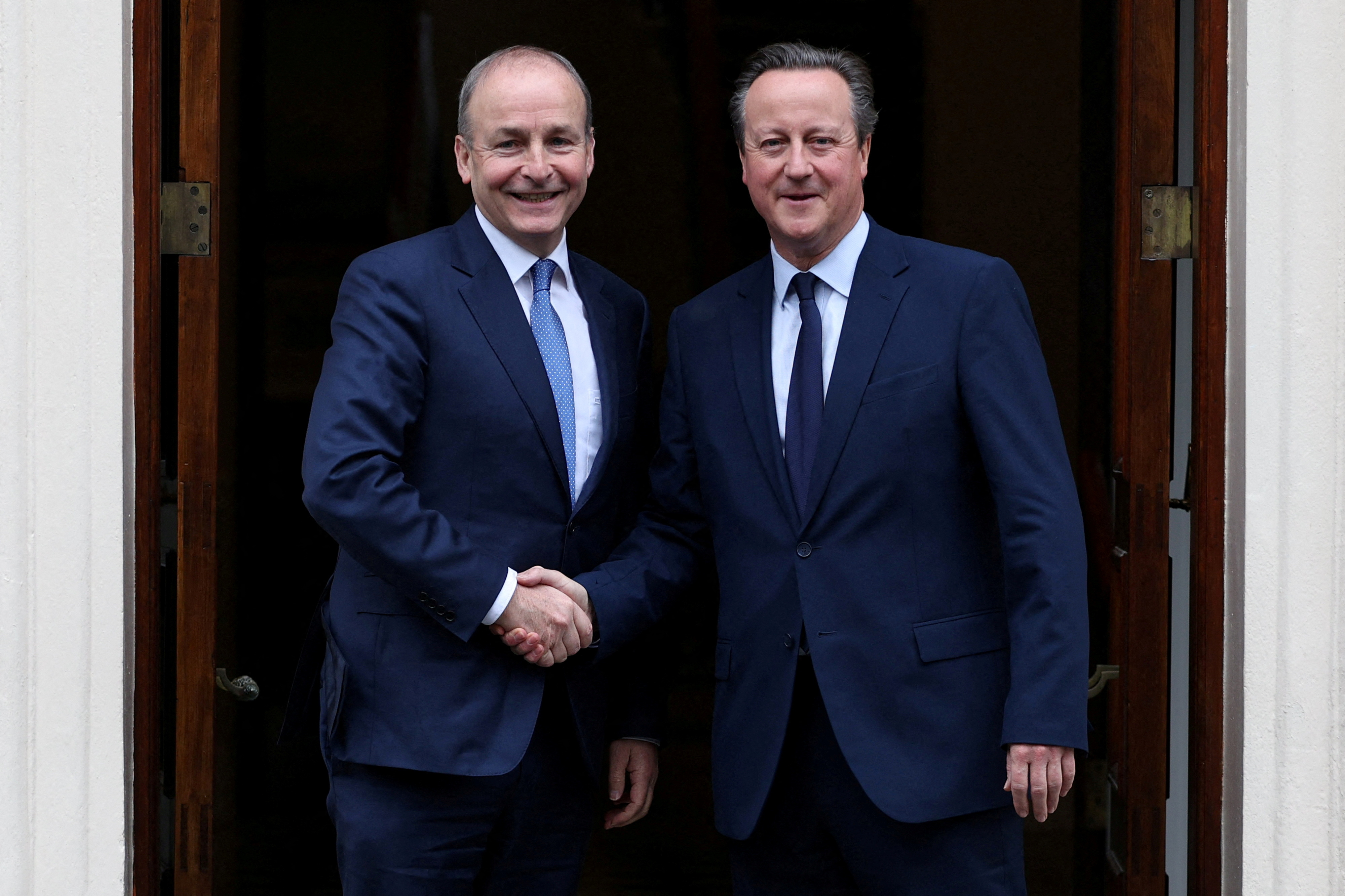 FILE PHOTO: Britain's Foreign Secretary David Cameron meets Ireland's Deputy Prime Minister and Foreign Minister Micheal Martin in London