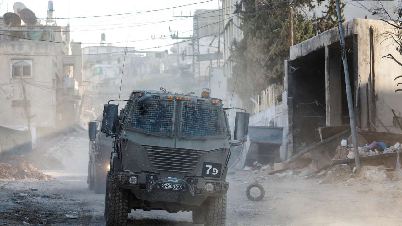 Israeli military vehicles operate during an Israeli raid in Tulkarm