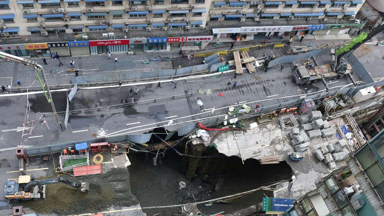 Sinkhole at a road section where a subway construction site collapsed, in Chengdu