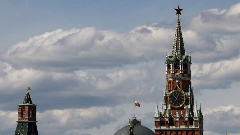The Russian flag flies on the dome of the Kremlin Senate building in Moscow
