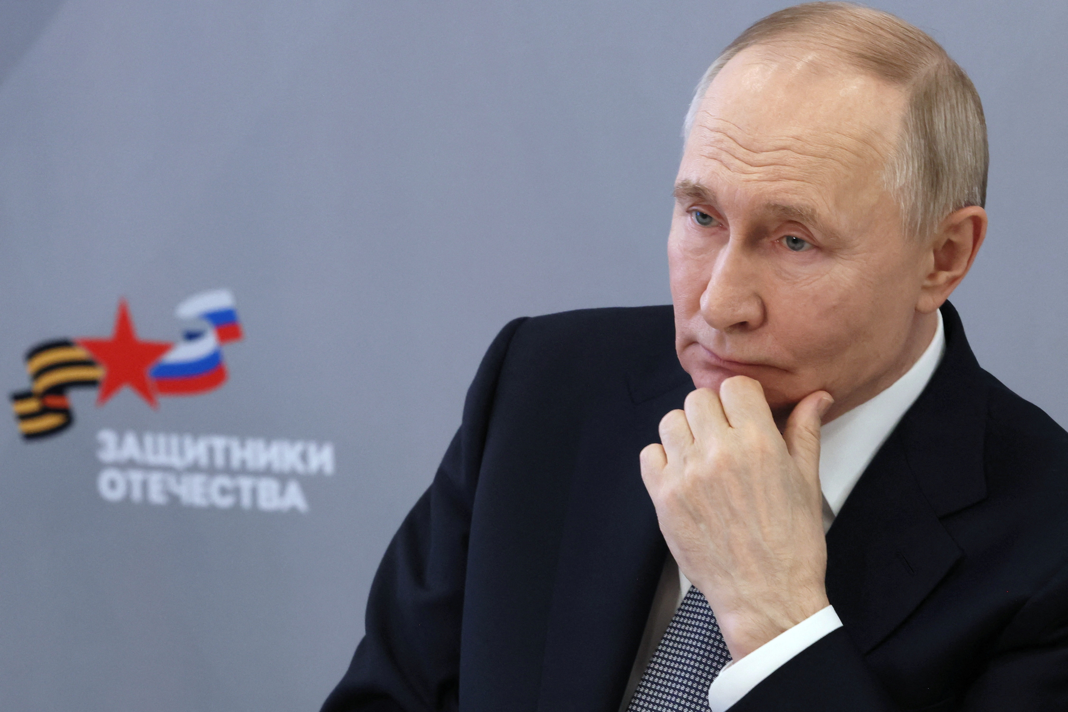 Russian President Vladimir Putin meets with employees and wards of the Defenders of the Fatherland state fund, in Moscow