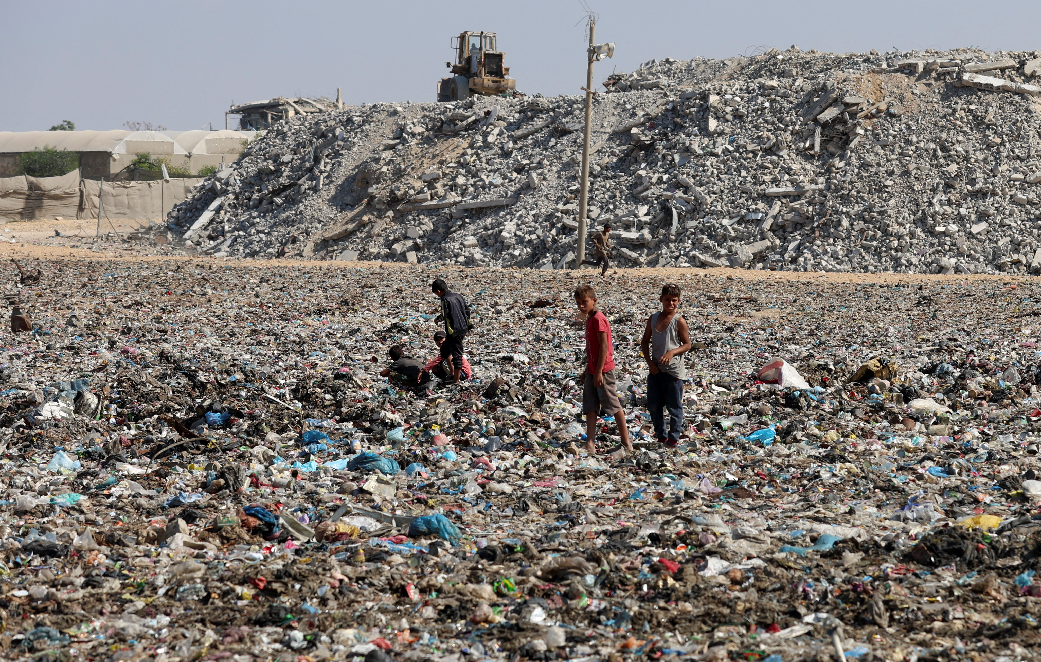 Piles of garbage and seeping sewage pollute devastated Gaza in Khan Younis