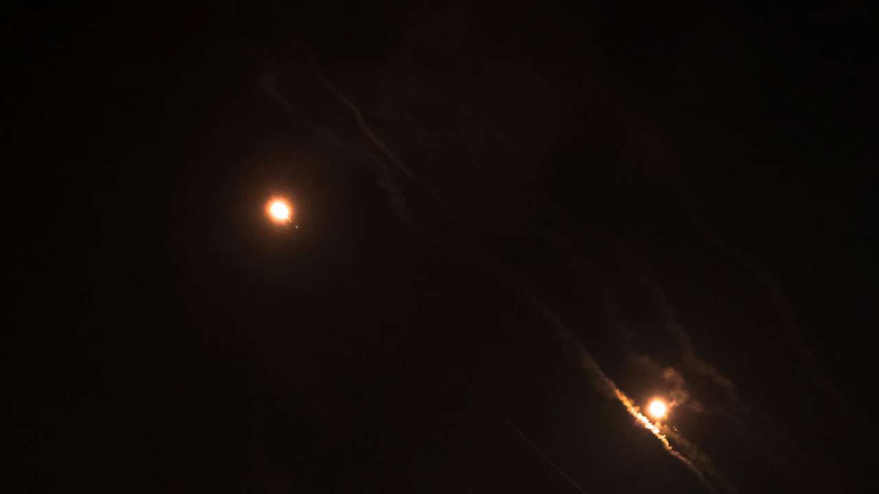 Objects are seen in the sky above Jerusalem after Iran launched drones and missiles towards Israel, in Jerusalem