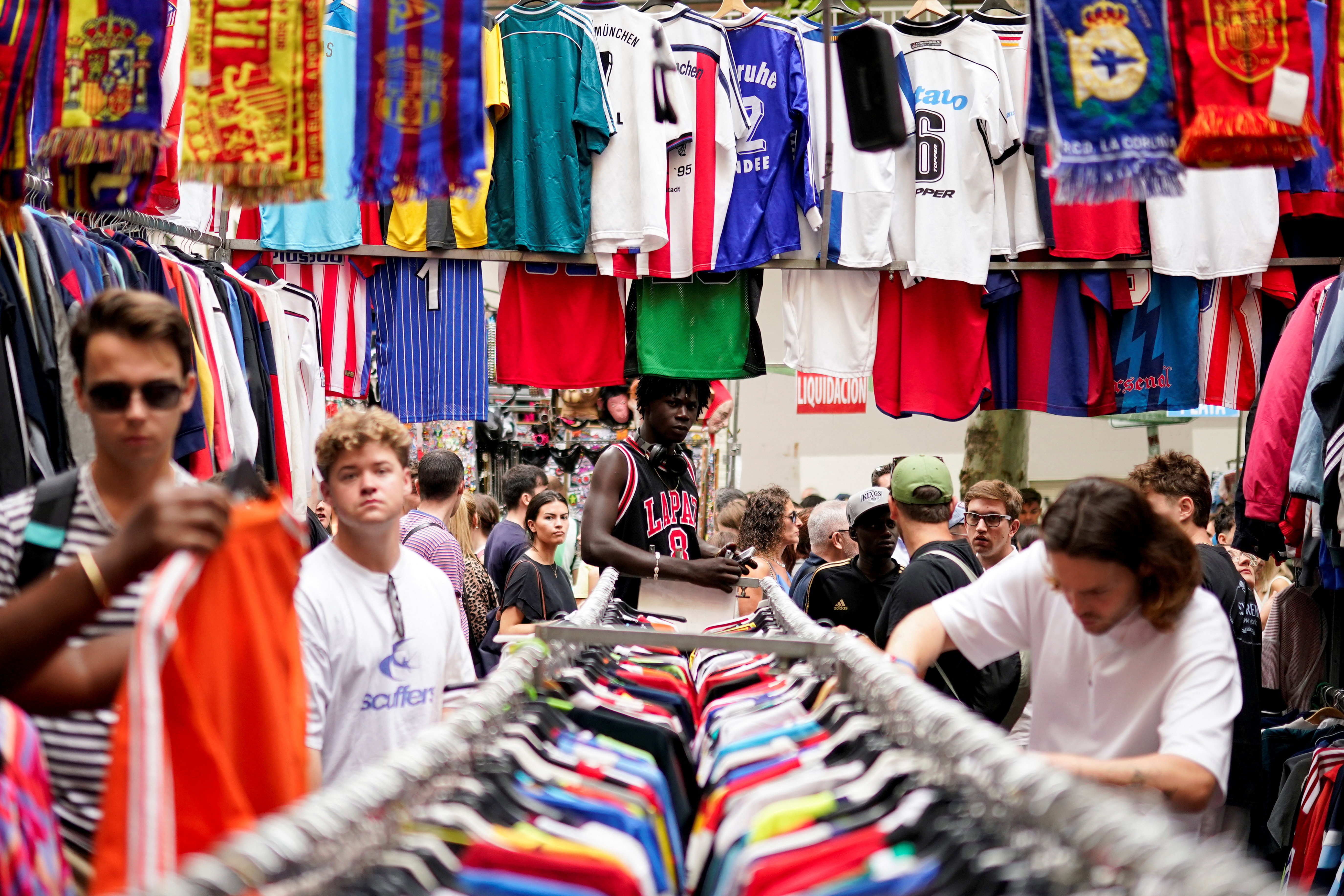 People visit El Rastro open-air market in Madrid