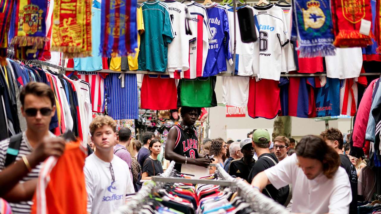 People visit El Rastro open-air market in Madrid