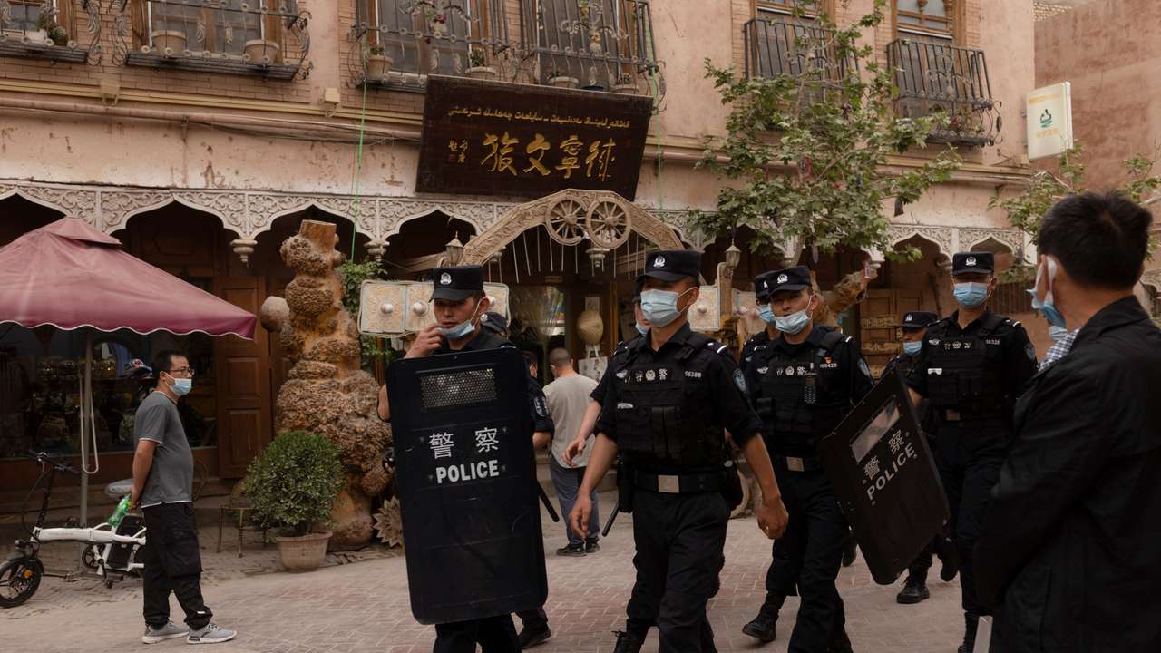 The Wider Image: In China's new Xinjiang: patriotic tourism, police and propaganda