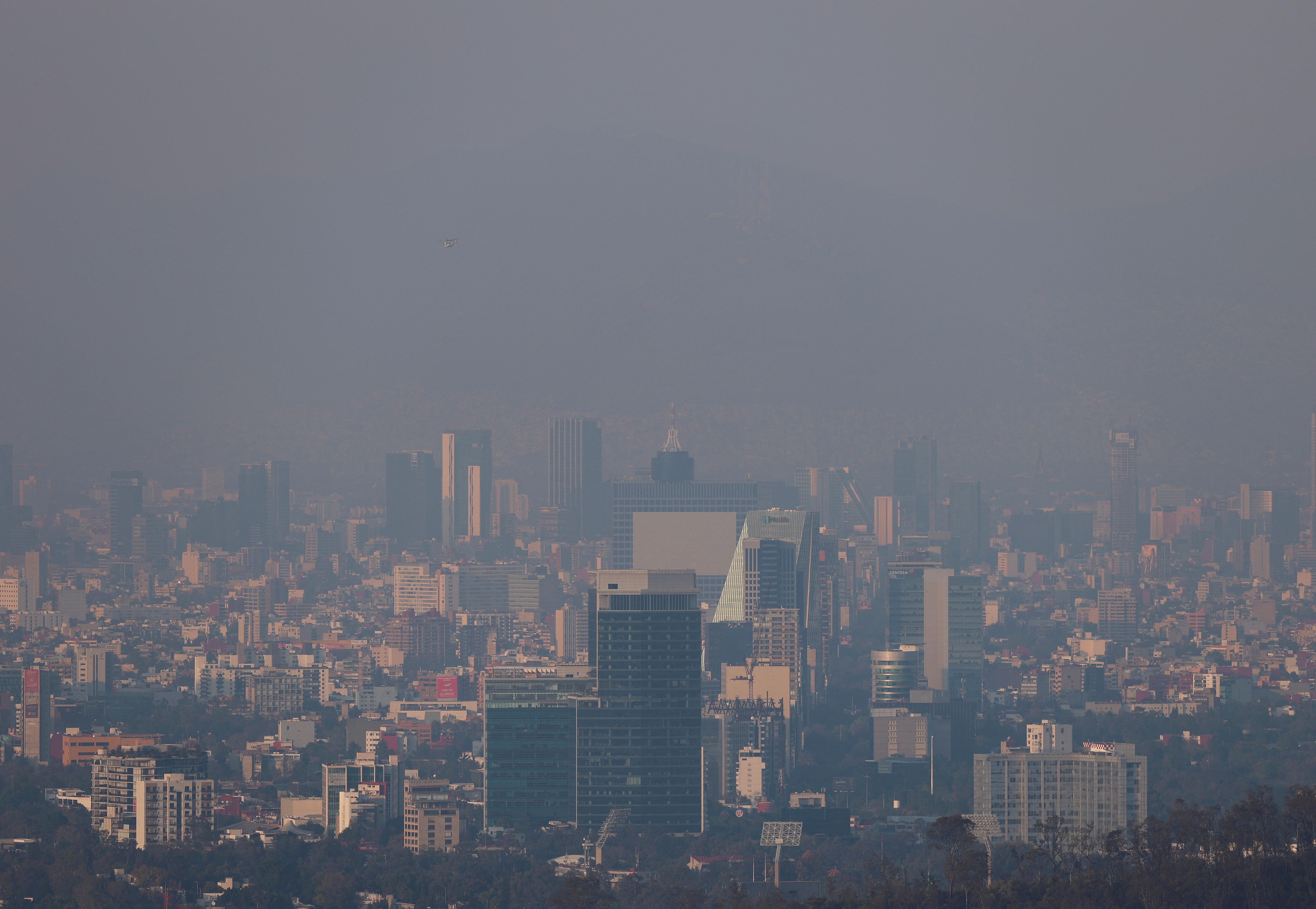A general view of buildings and houses amid pollution on New Year's Day in Mexico City