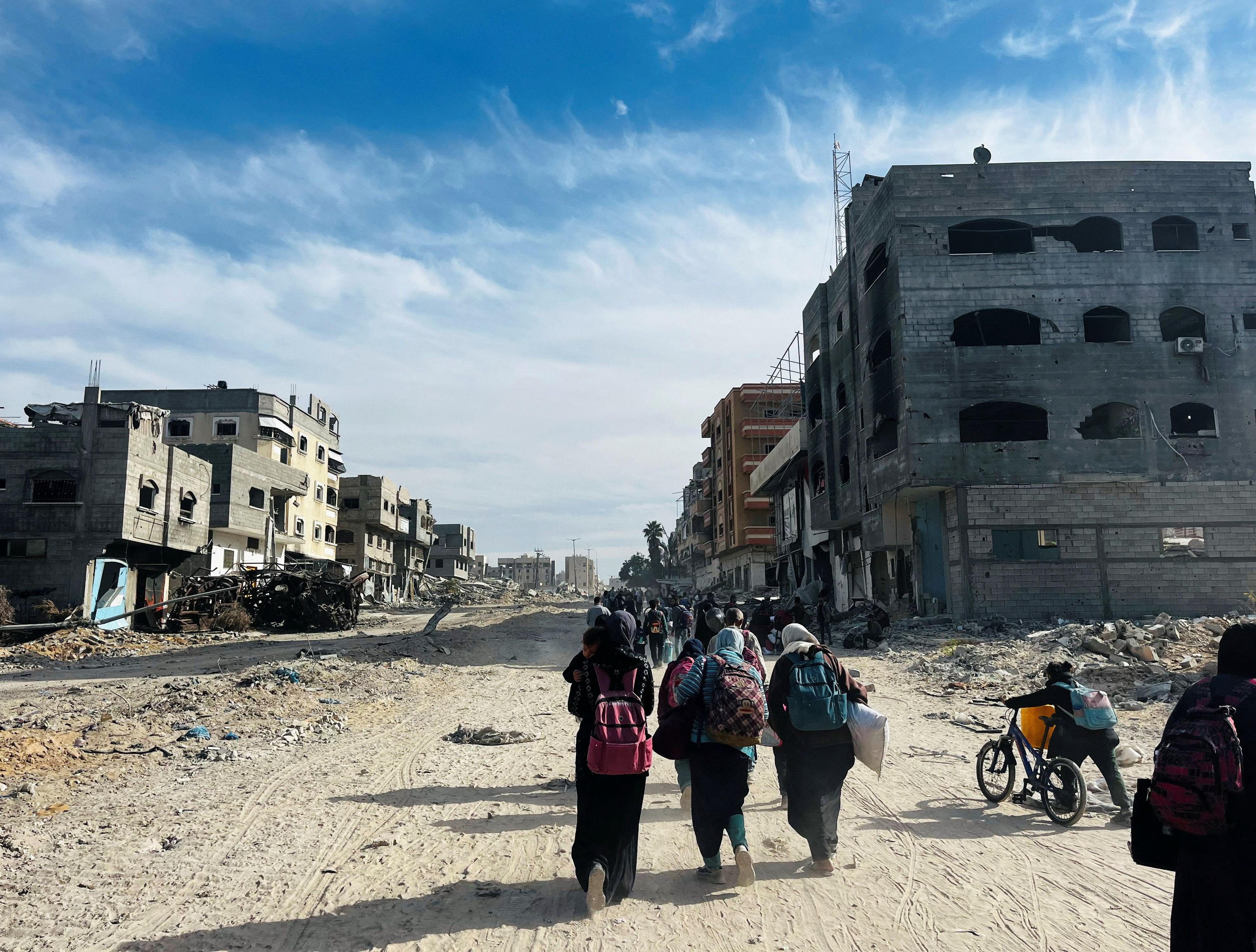 Palestinians flee during an Israeli military operation, in Beit Lahiya in the northern Gaza Strip