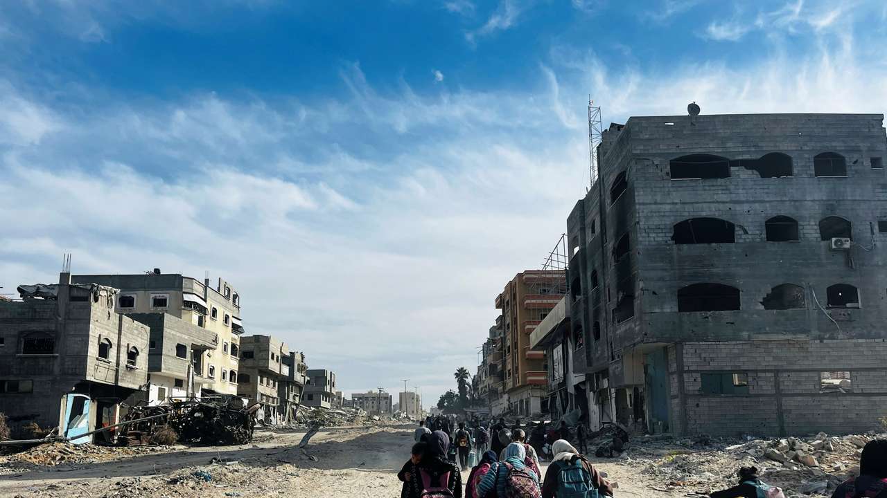 Palestinians flee during an Israeli military operation, in Beit Lahiya in the northern Gaza Strip