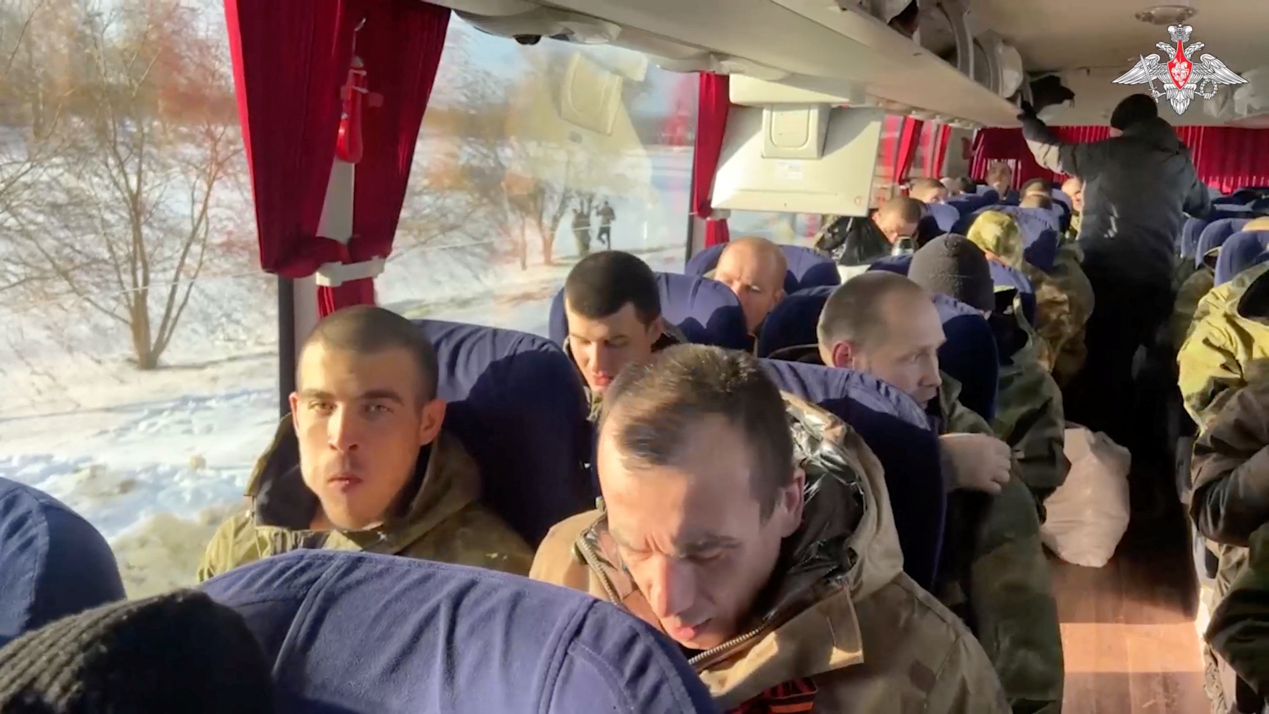 A still image from video, released by the Russian Defence Ministry, shows what it said to be captured Russian service personnel in a bus following the latest exchange of prisoners of war