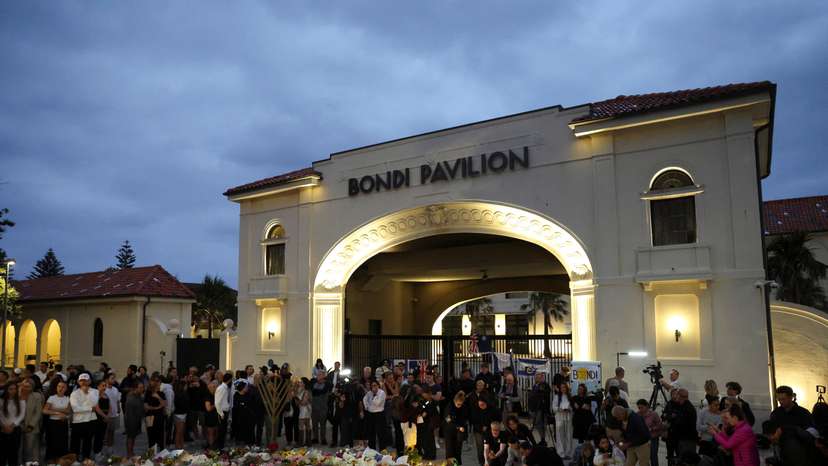 People pay respects at Bondi Pavilion to victims of a shooting during a Jewish holiday celebration at Bondi Beach, in Sydney
