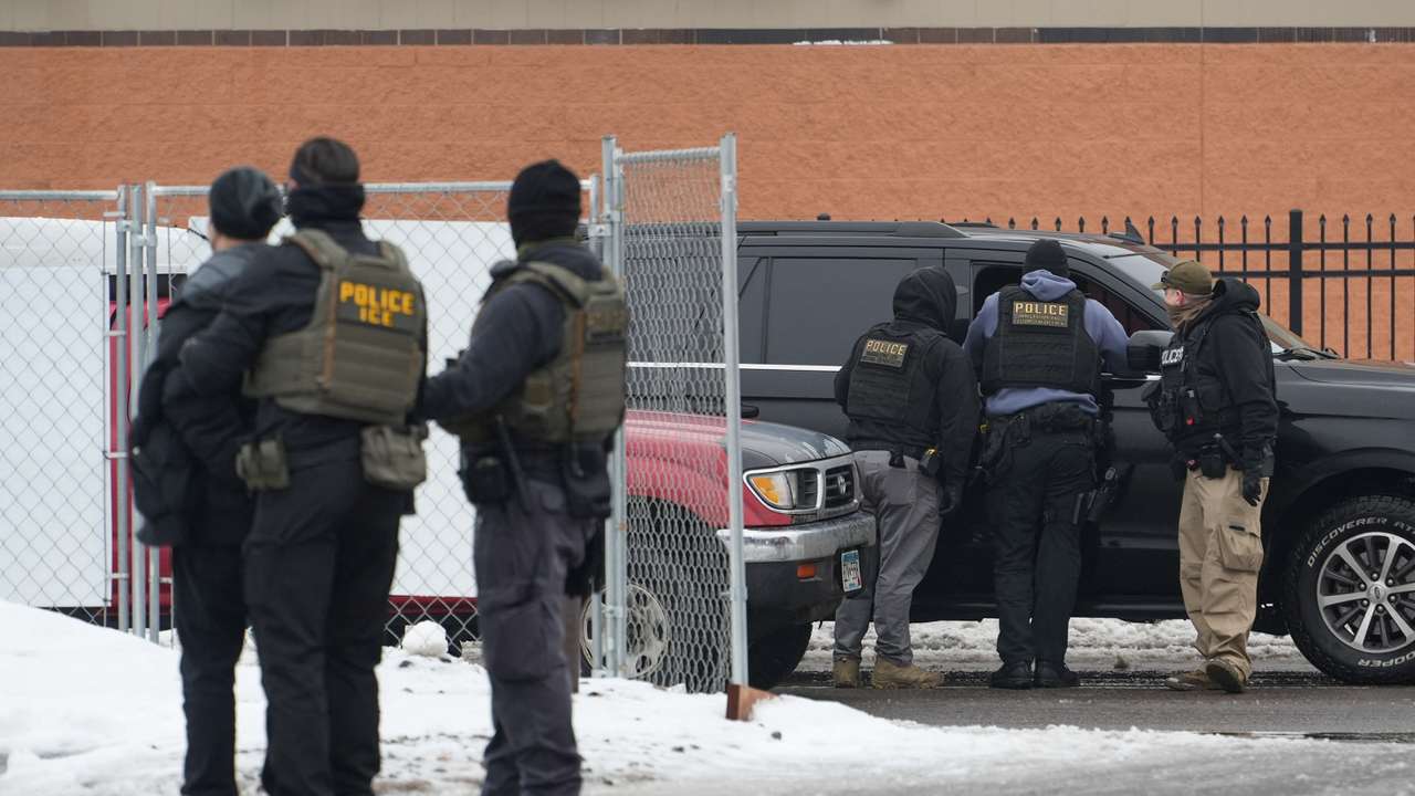 Members of U.S. Immigration and Customs Enforcement (ICE) conduct raids in Minneapolis