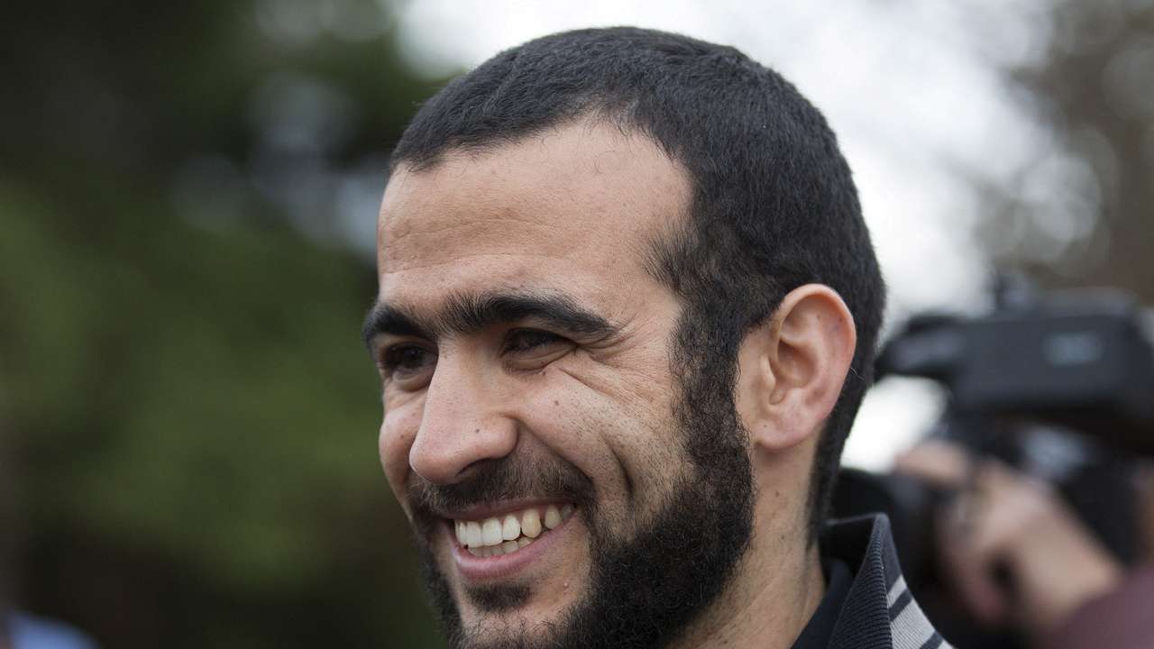 FILE PHOTO: Omar Khadr smiles as he answers questions during a news conference after being released on bail in Edmonton, Alberta