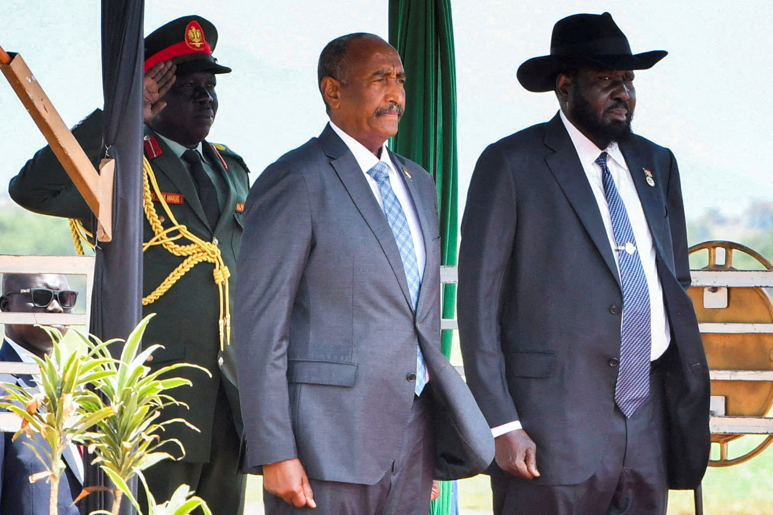 FILE PHOTO: Sudan's Sovereign Council Chief General Abdel Fattah al-Burhan, stands with South Sudanese President Salva Kiir upon arriving at the Juba International Airport, in Juba