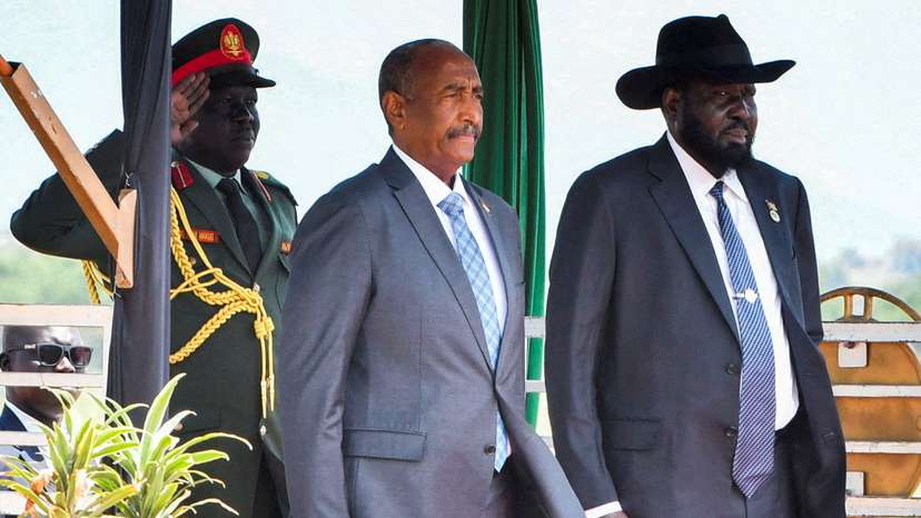FILE PHOTO: Sudan's Sovereign Council Chief General Abdel Fattah al-Burhan, stands with South Sudanese President Salva Kiir upon arriving at the Juba International Airport, in Juba