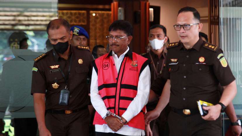 Indonesian Communications and Informatics Minister Johnny G. Plate, walks at the Attorney General's Office following accusations of corruption in Jakarta
