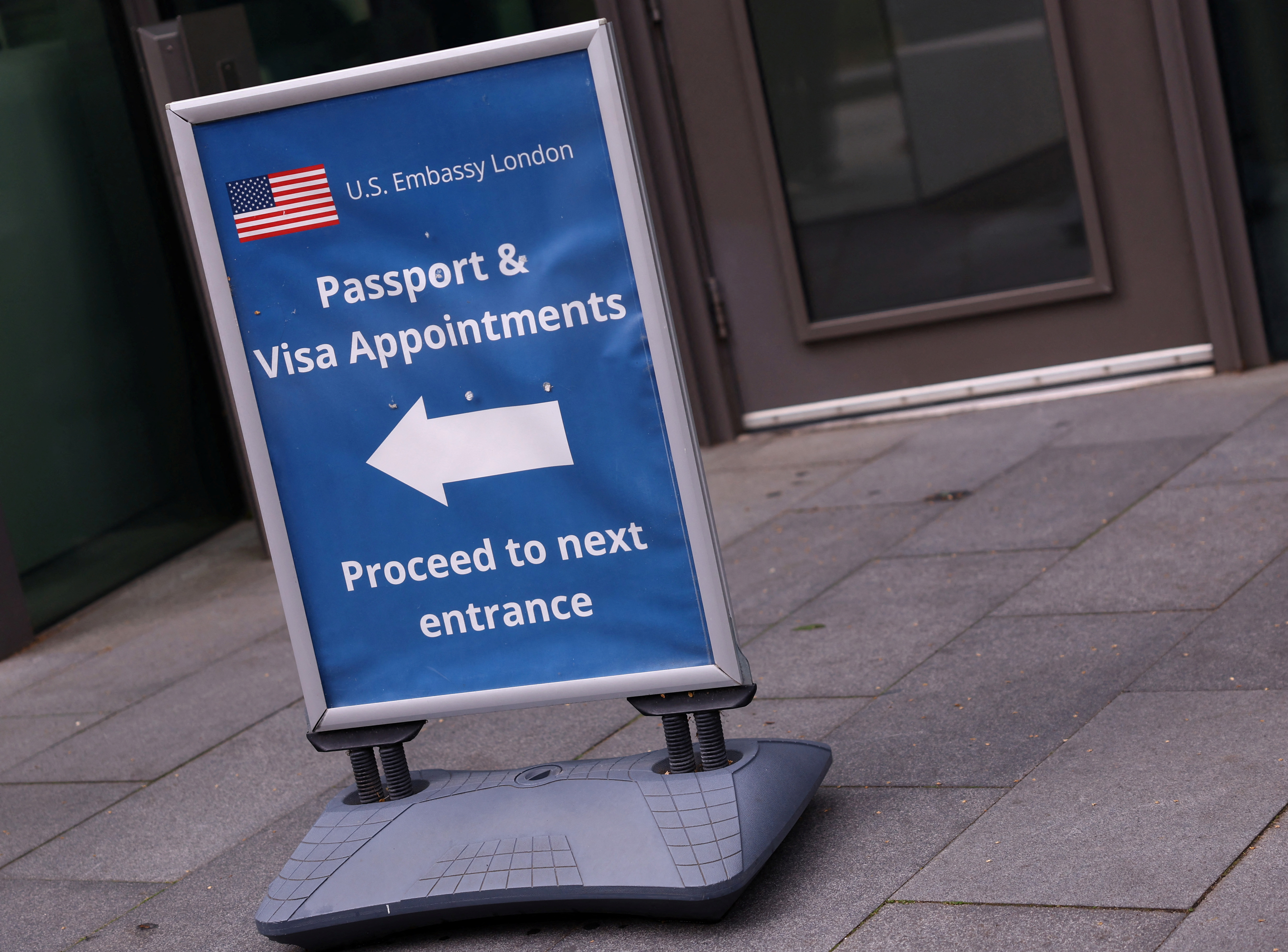 People queue to enter the U.S. embassy in London
