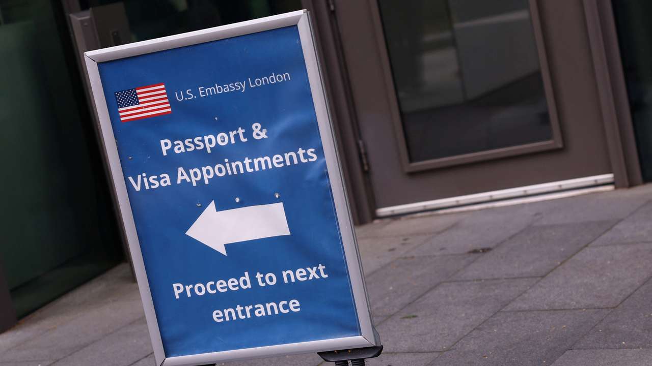People queue to enter the U.S. embassy in London