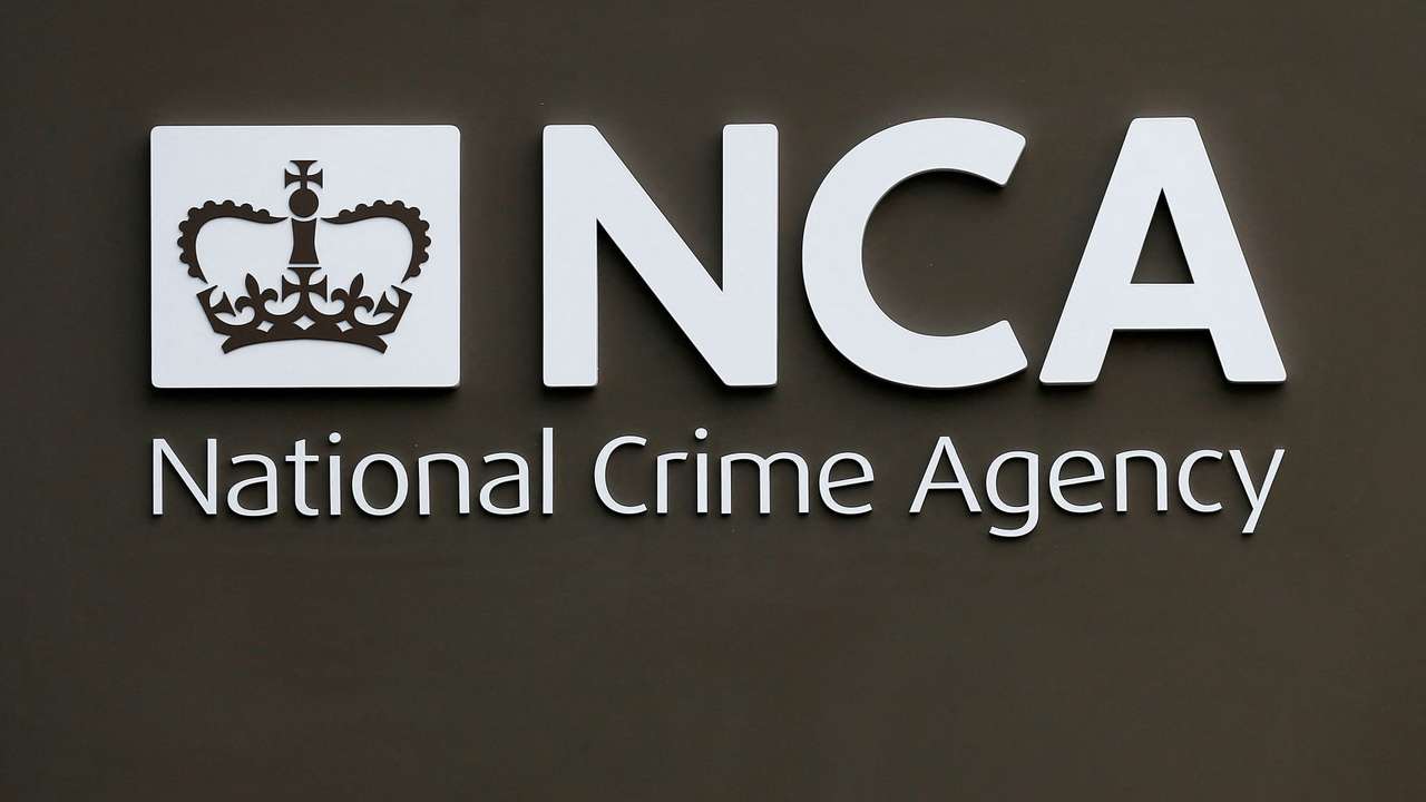 FILE PHOTO: A sign is seen outside the National Crime Agency headquarters in London