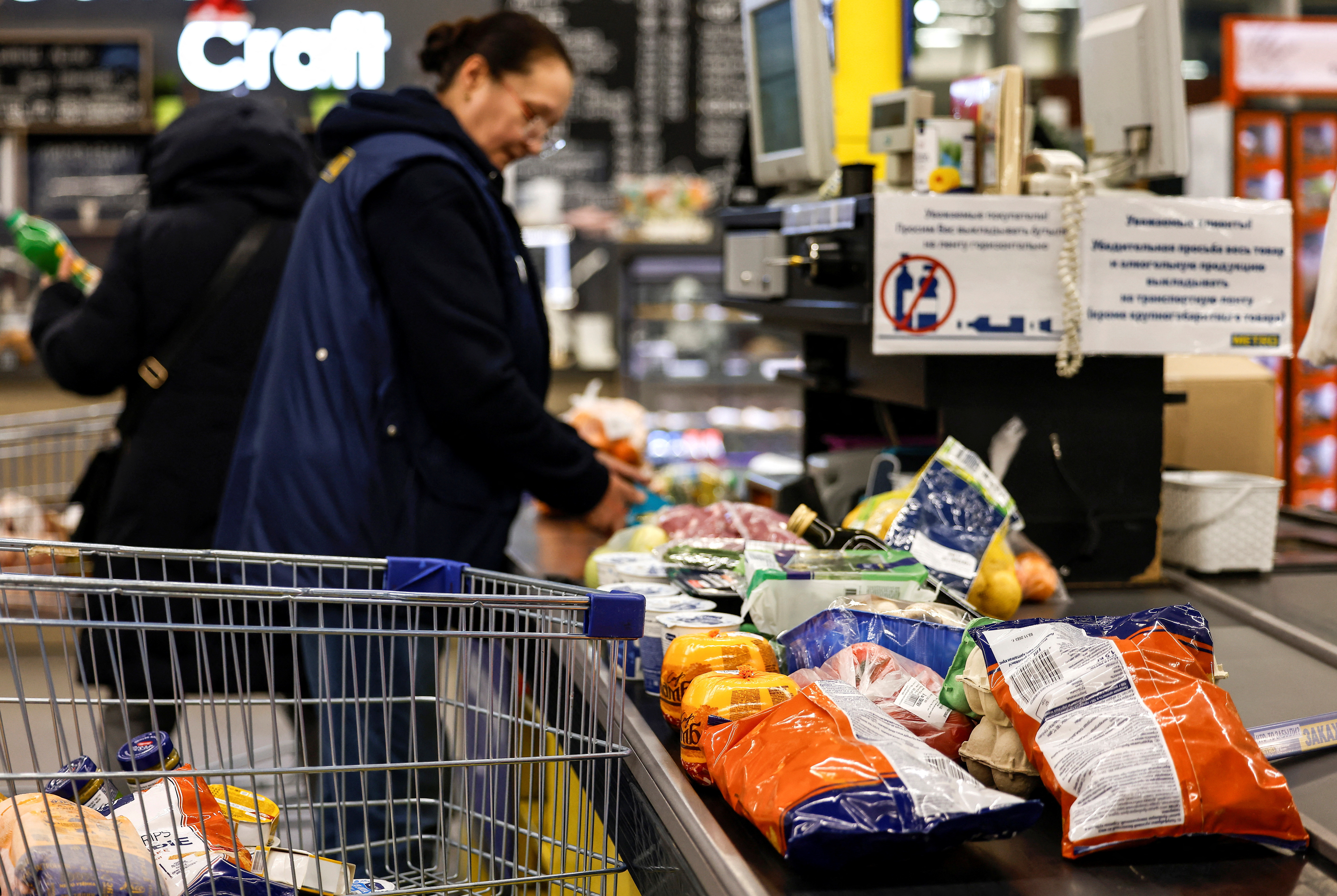 People shop at a Metro Cash and Carry hypermarket in Moscow