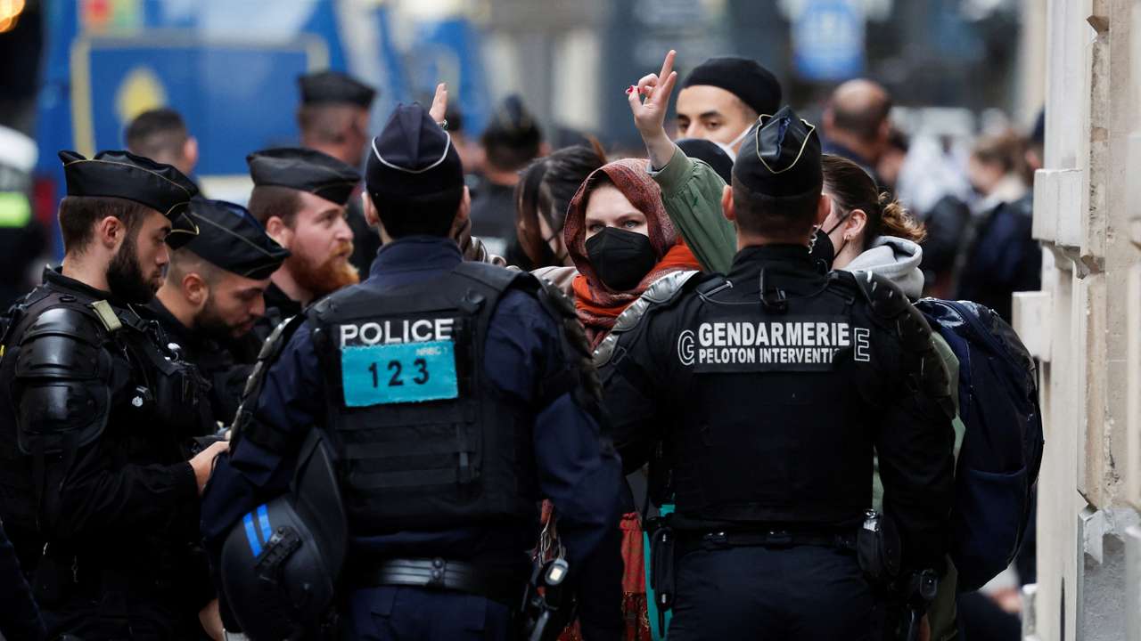 Protesters in support of Palestinians in Gaza are escorted away by police forces during the evacuation of the Sciences Po University, in Paris