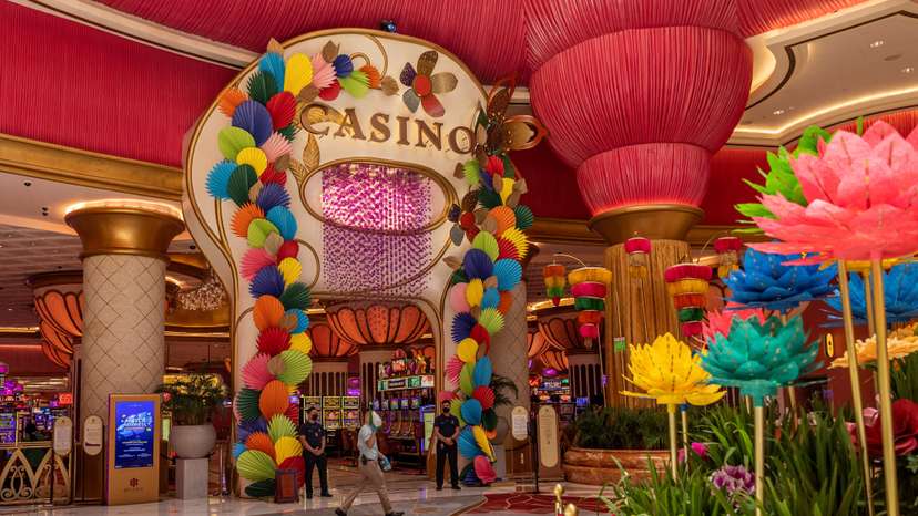 FILE PHOTO: A worker walks past the casino at Okada Manila in Paranaque