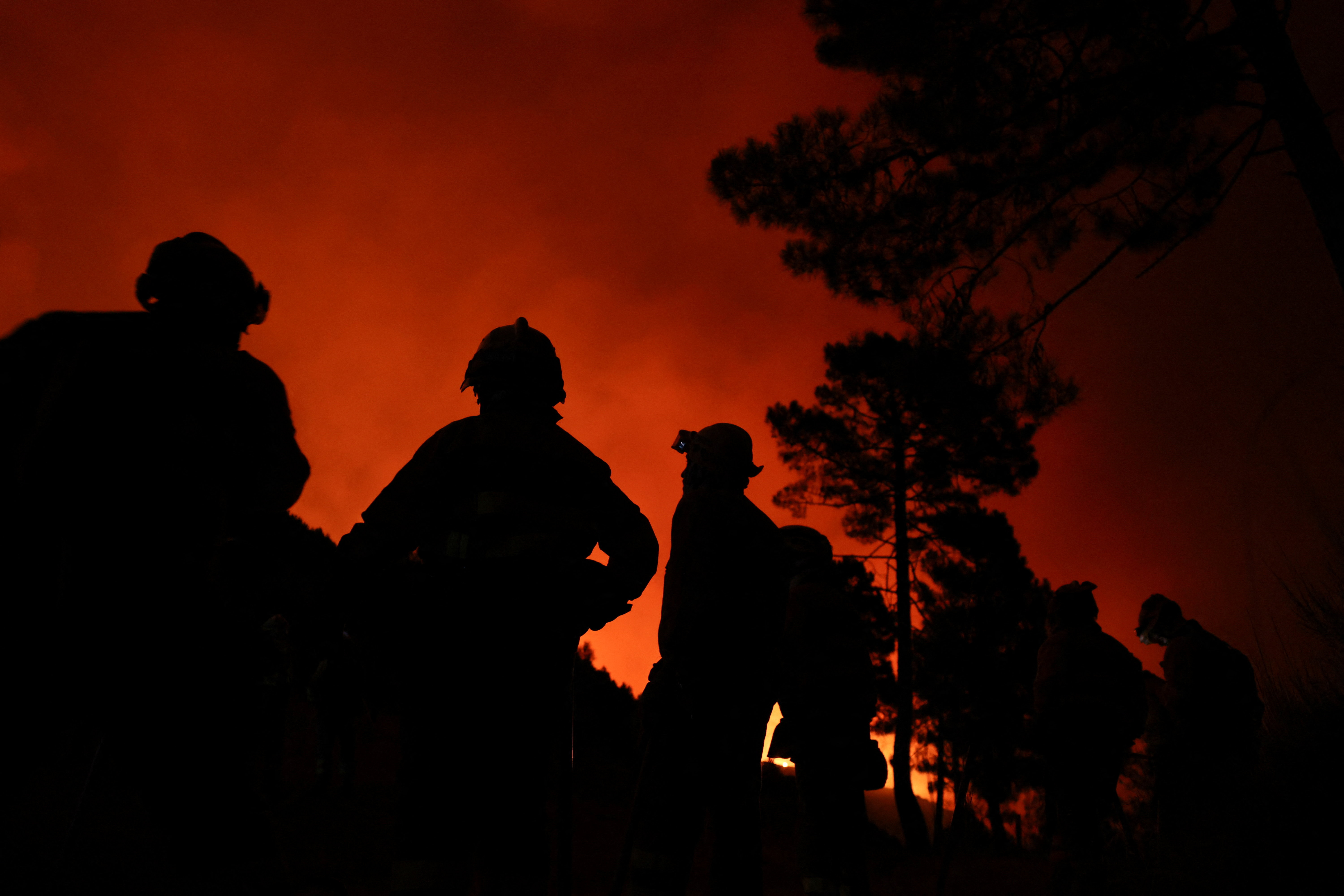 Firefighters battle a wildfire raging in Spain’s Avila region