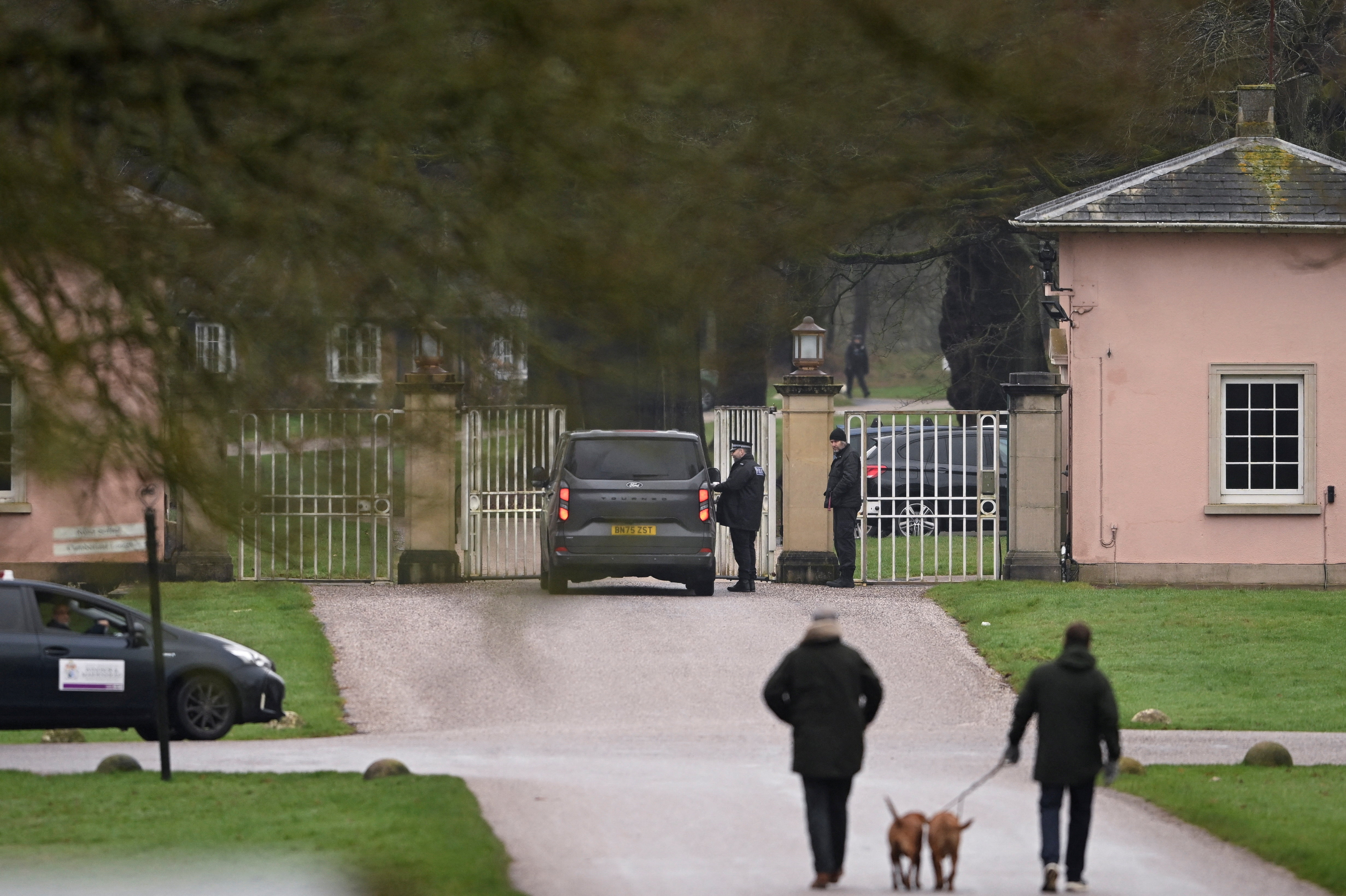 Police vehicles are parked outside Royal Lodge, amid a report of an arrest, in Windsor