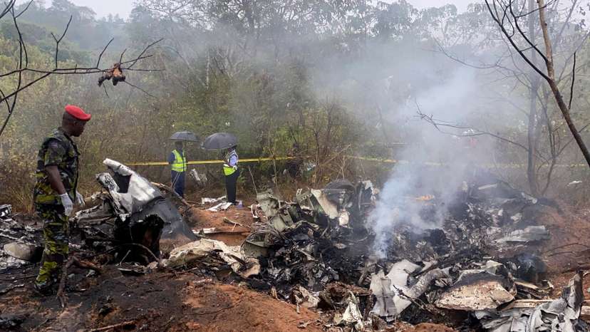 Security officials secure the wreckage of the aircraft 5Y-CCA operated by Mombasa Air Services, which crashed in Kwale County