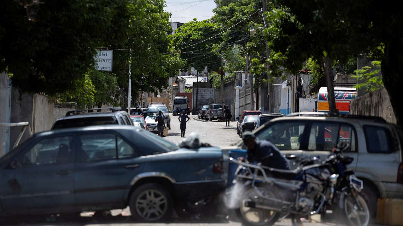 A view of a makeshift barricade built by residents out of abandoned vehicles to block a road and prevent gangs from entering their community, in Port-au-Prince