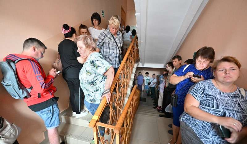 People receive humanitarian aid in Russia's Kursk