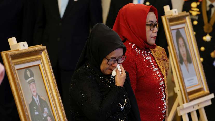 Wijiati and Marsini, sisters of labour activist Marsinah, attend the national hero ceremony during National Heroes' Day at the Merdeka Palace in Jakarta