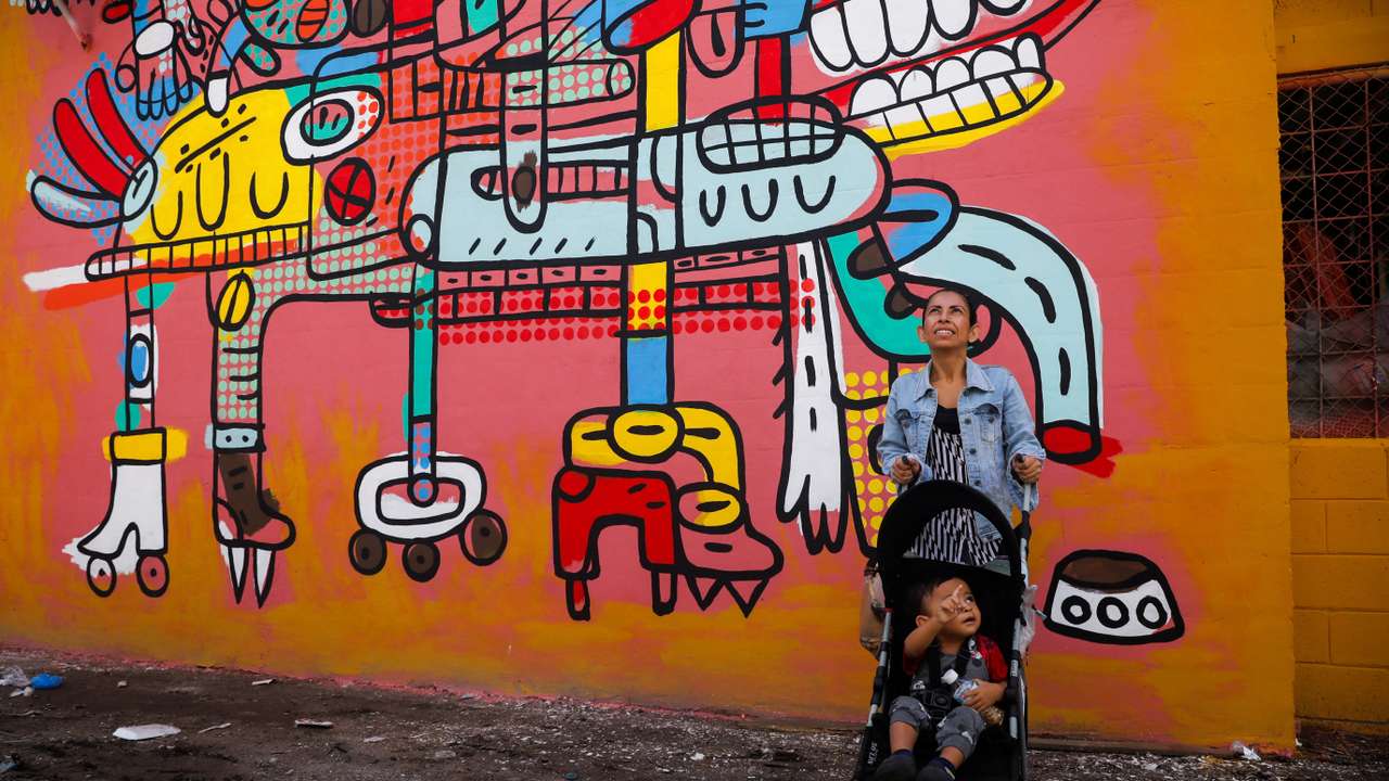 Artists seek to erase traces of violence with murals in a neighborhood in El Salvador