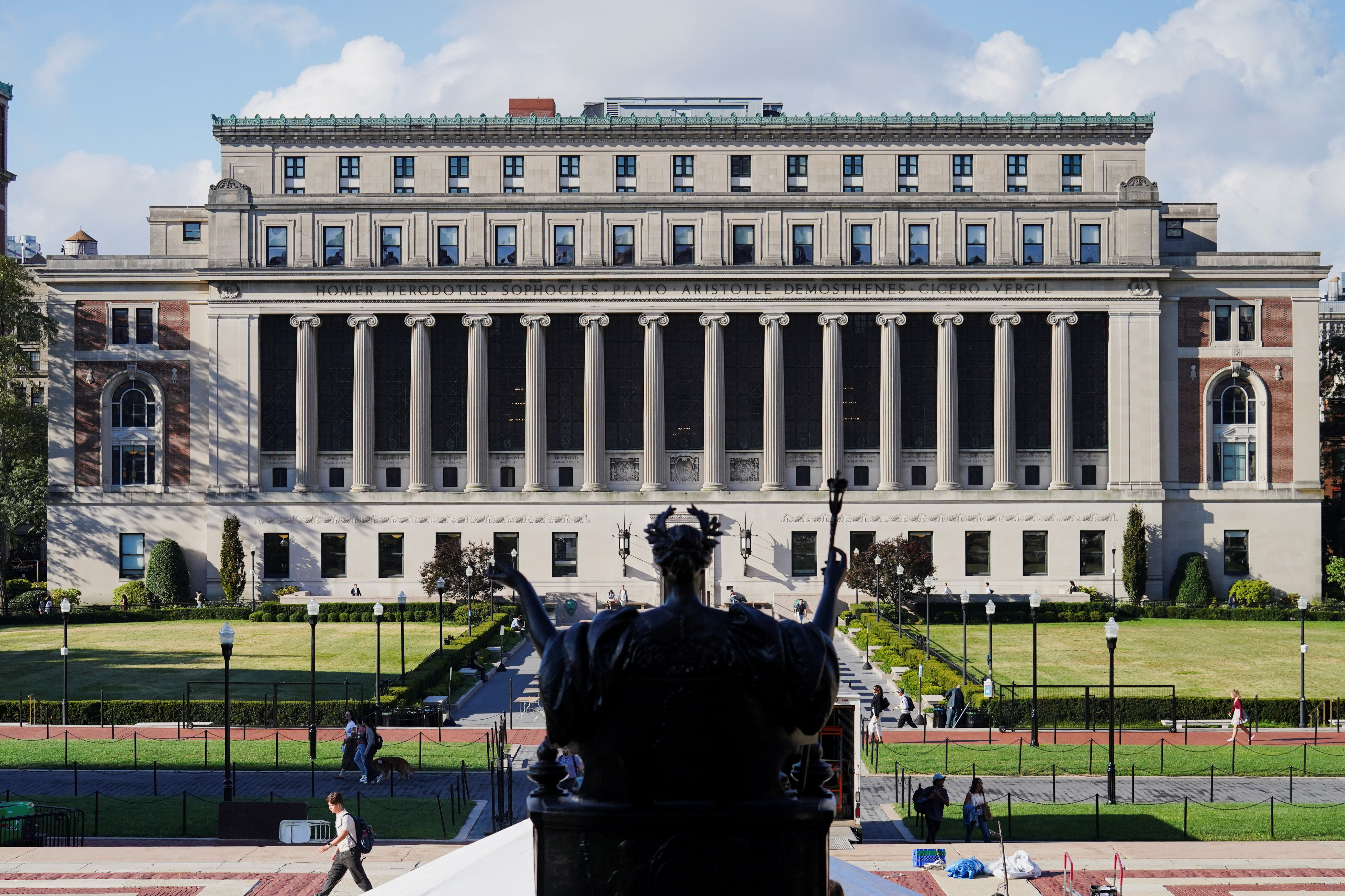 Students walk on campus at Columbia University during the first day of the fall semester