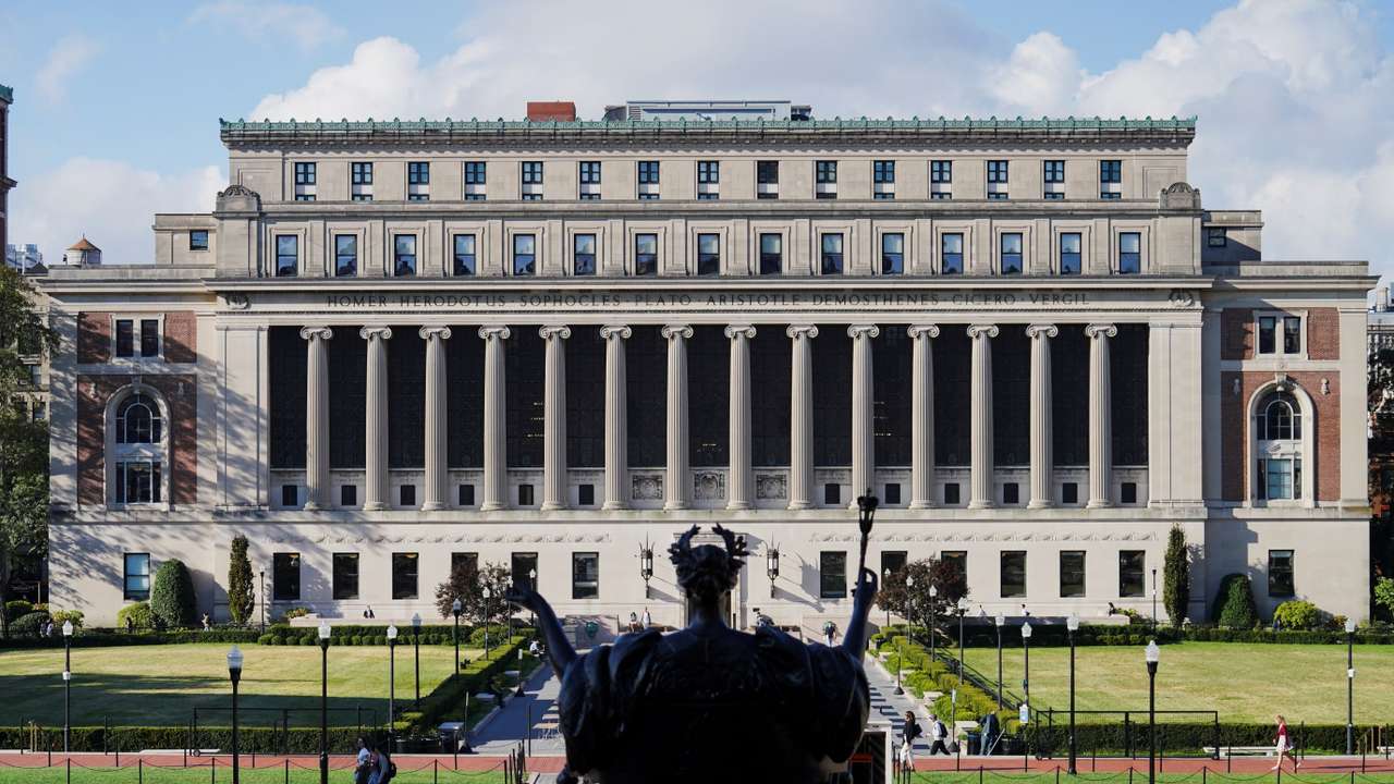 Students walk on campus at Columbia University during the first day of the fall semester