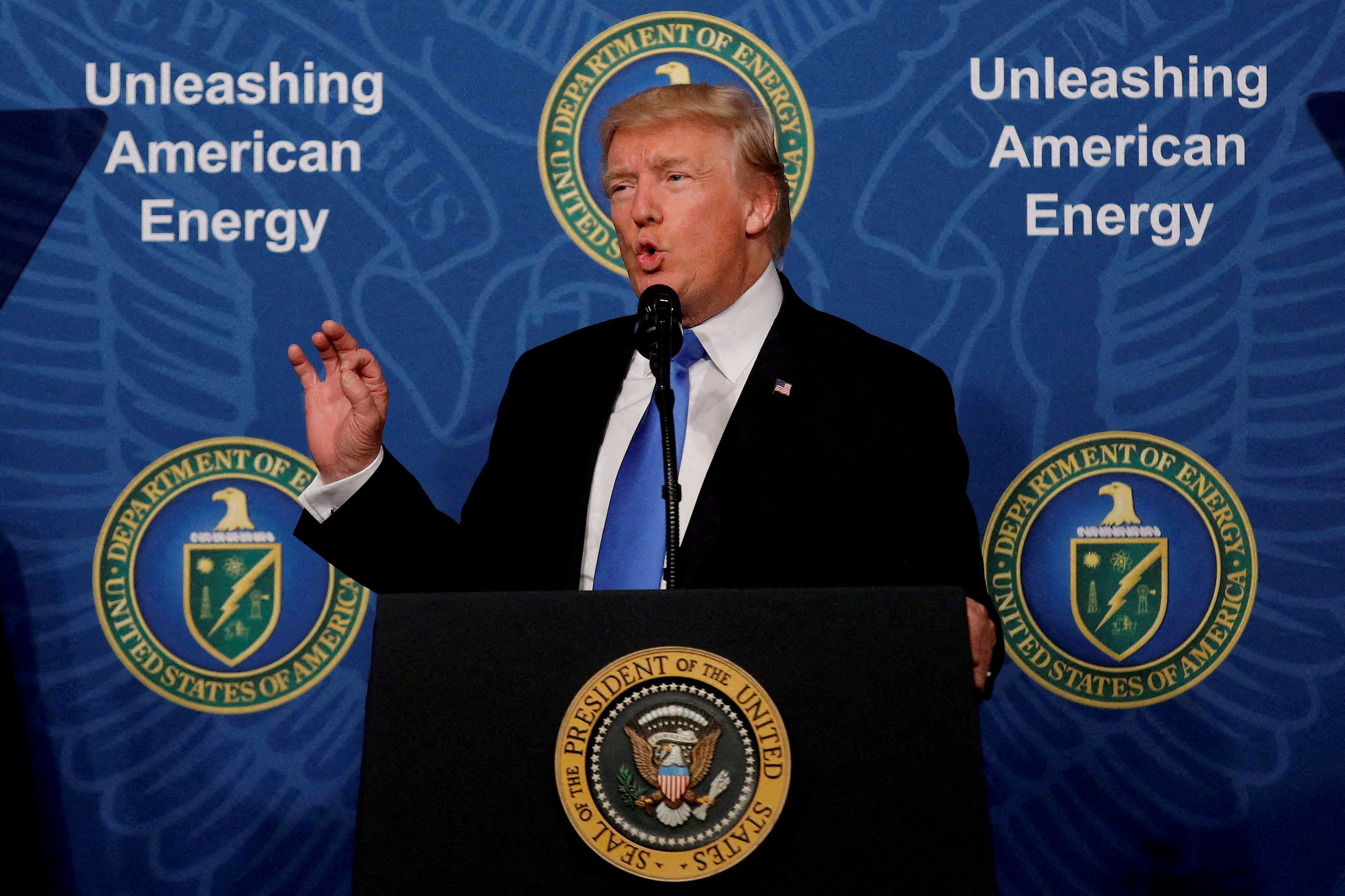 FILE PHOTO: U.S. President Donald Trump delivers remarks during an 'Unleashing American Energy' event at the Department of Energy in Washington