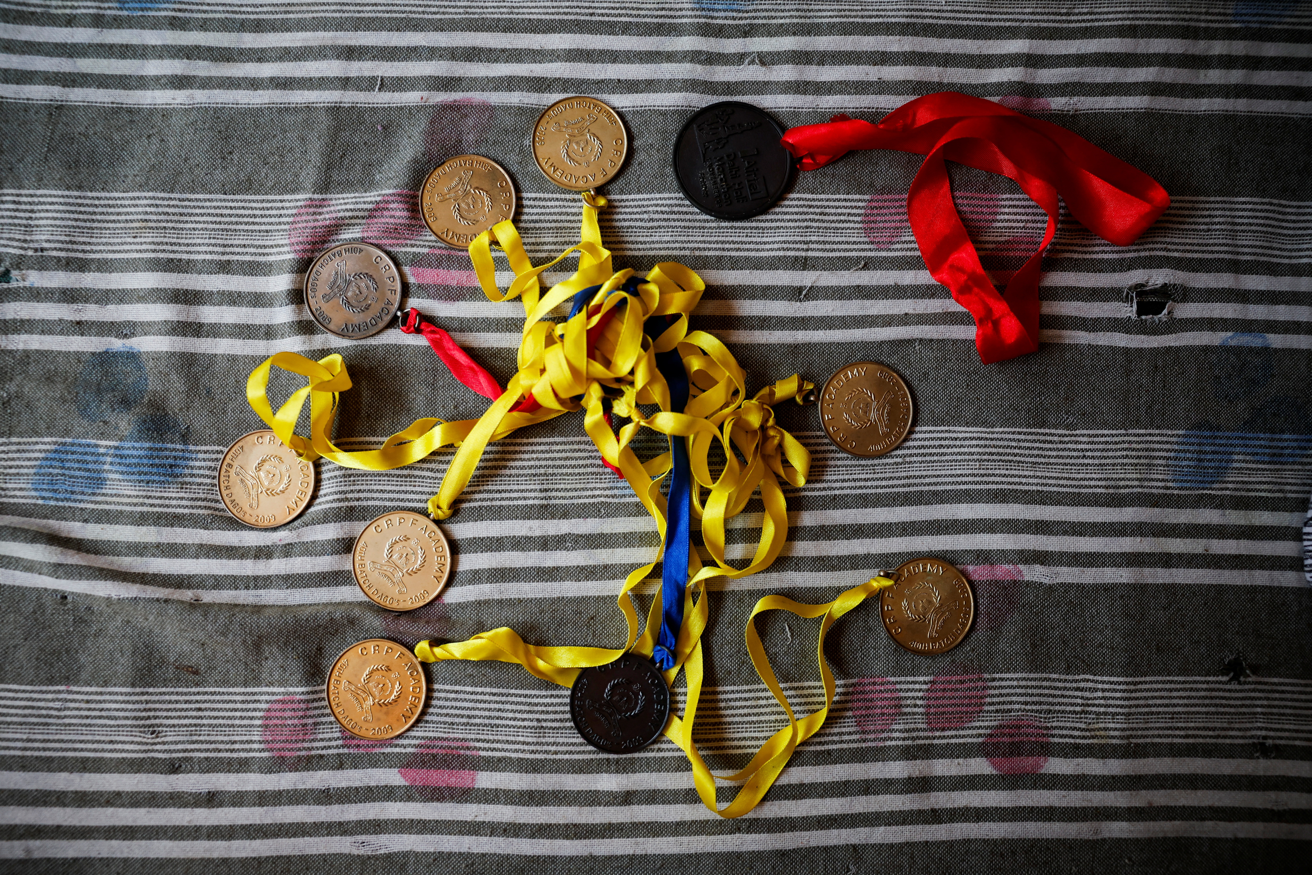 Medals awarded to Vikash Yadav, an Indian ex-official charged by the U.S. with directing a murder-for-hire plot, an allegation his family say he has dismissed, are laid out to show the media at a family home, in Pranpura village in Haryana