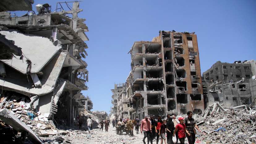 Palestinians inspect the damage after Israeli forces withdrew from Jabalia refugee camp
