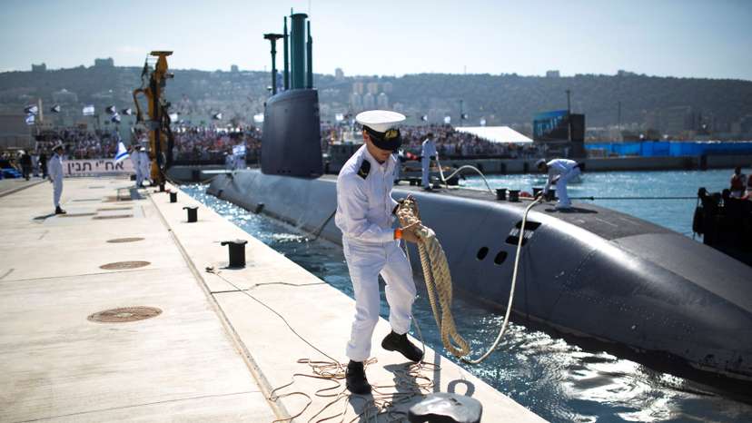 FILE PHOTO: An Israeli naval officer stands on the pier in Haifa as INS Tanin docks after its arrival in Israel